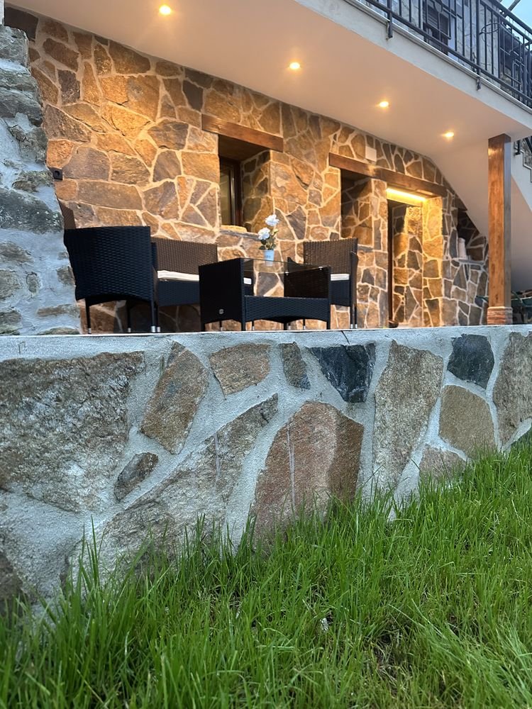 Stone terrace with table and chairs