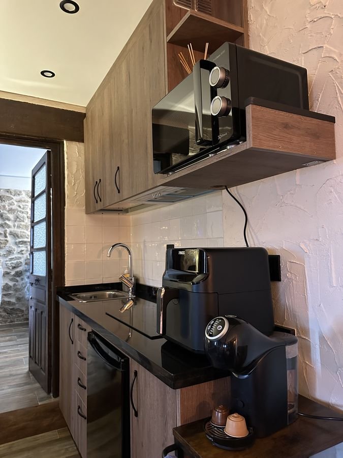 Compact kitchen with microwave and coffee maker