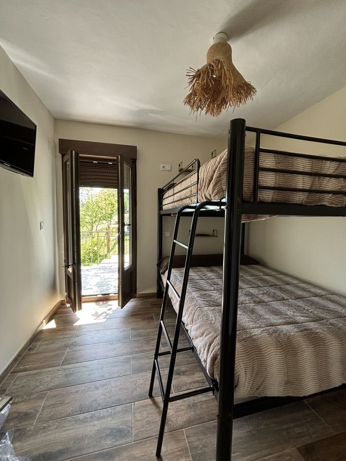 Bedroom with an iron bunk bed