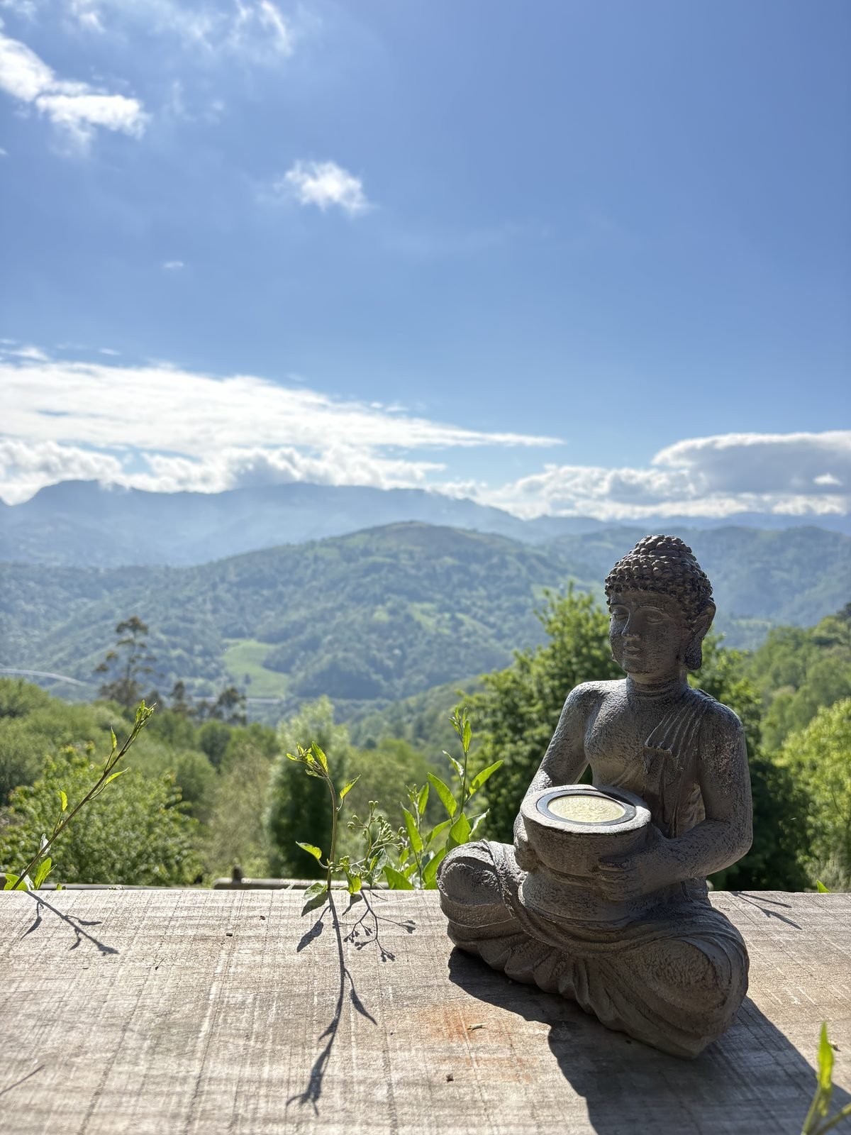 Buddha figure facing the mountains