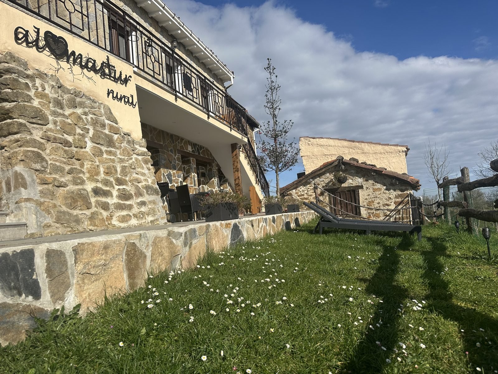 The stone house and the meadow in spring